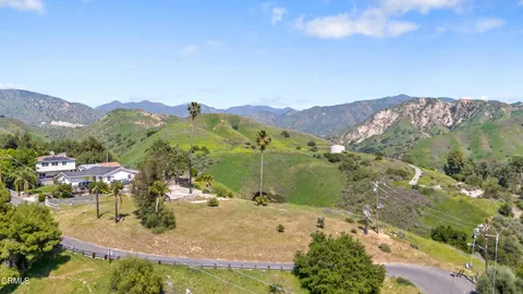 a view of a town with mountains in the background