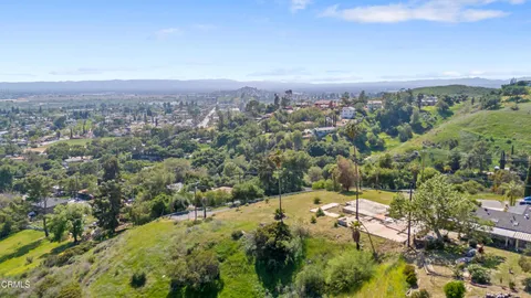 an aerial view of residential house with outdoor space