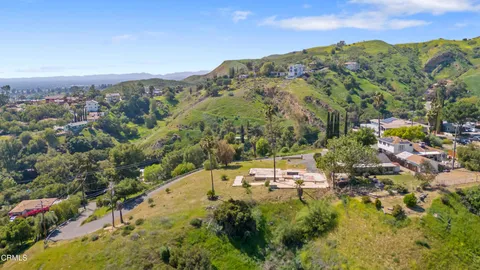 a view of a city with mountains in the background