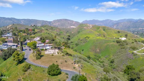 a view of a city with mountains in the background