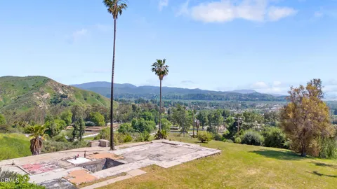 a view of a road with a mountain in the background