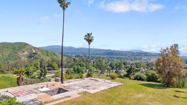 a view of a road with a mountain in the background