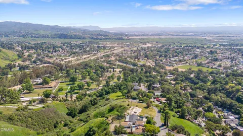 an aerial view of residential house and green space