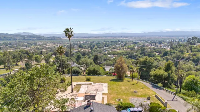 an aerial view of residential house with outdoor space