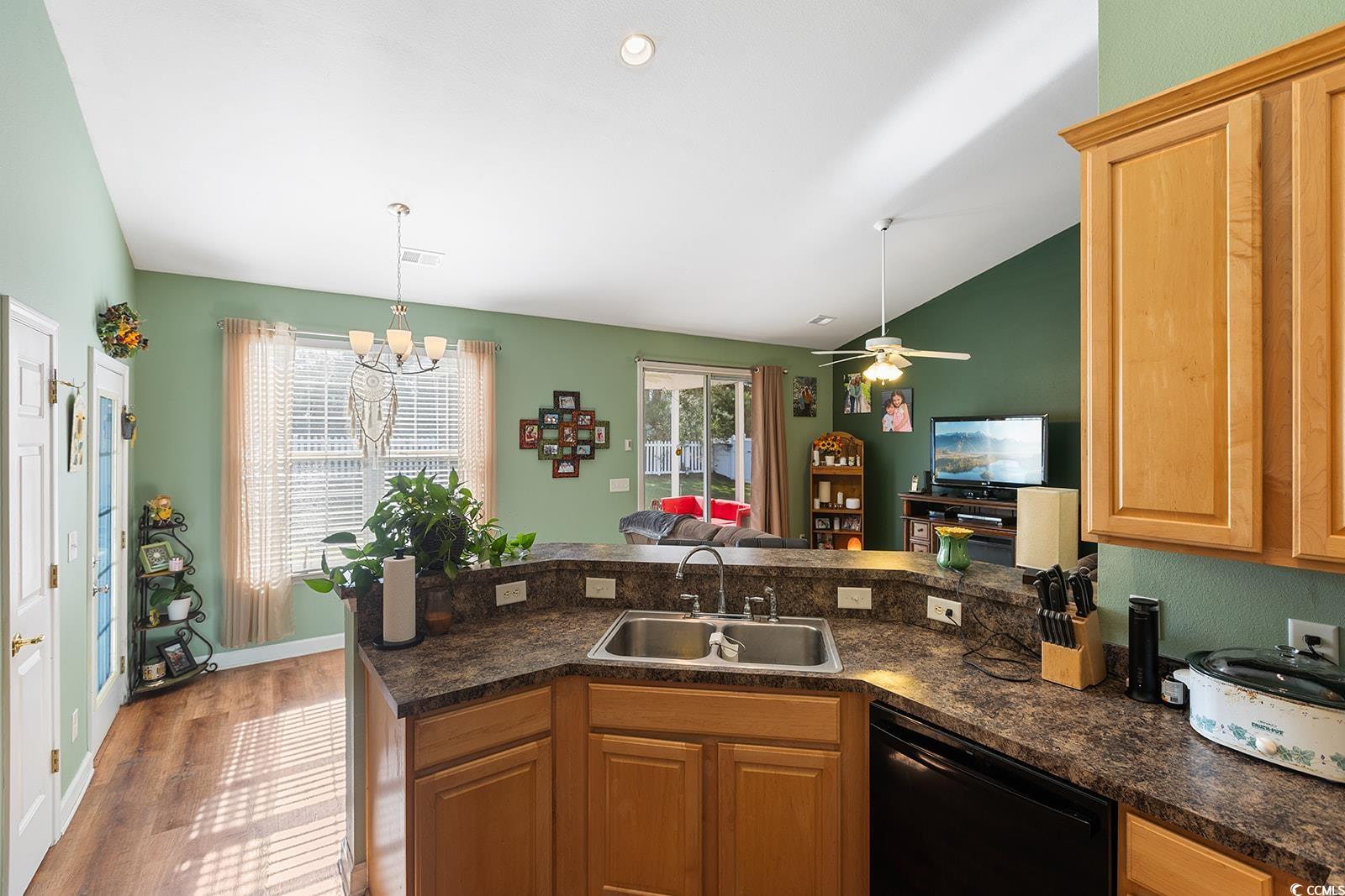 720 Gazania Lane Myrtle Beach, SC 29579 - Photo 32 of 32 Kitchen with dark countertops, dishwasher, open floor plan, ceiling fan, and wood finished floors