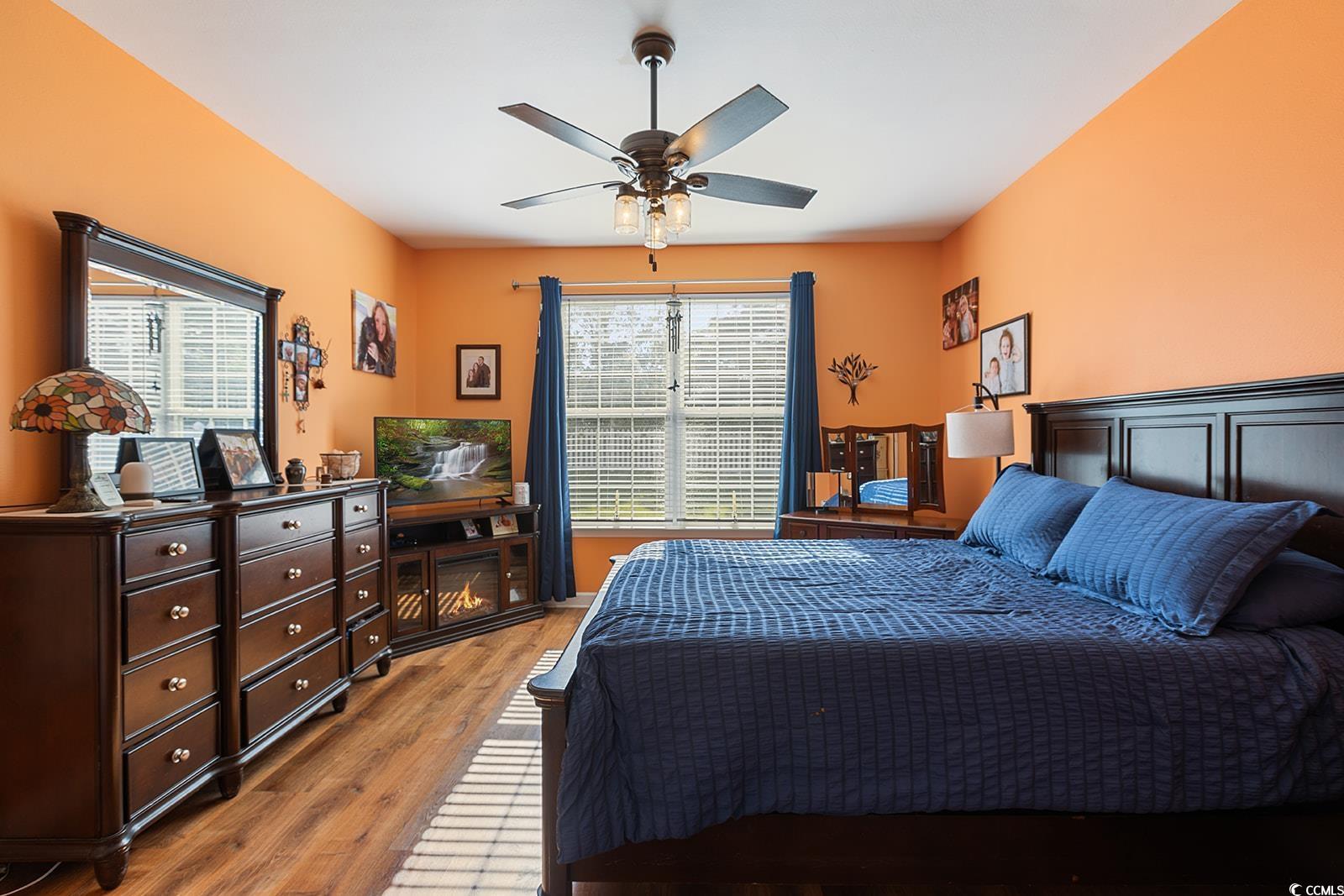 720 Gazania Lane Myrtle Beach, SC 29579 - Photo 13 of 32 Bedroom featuring wood finished floors and a ceiling fan