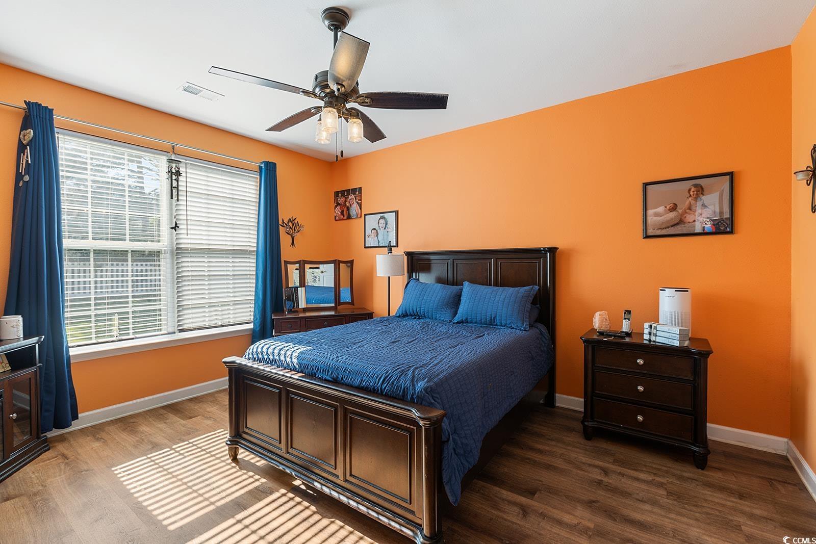 720 Gazania Lane Myrtle Beach, SC 29579 - Photo 15 of 32 Bedroom featuring wood finished floors and a ceiling fan