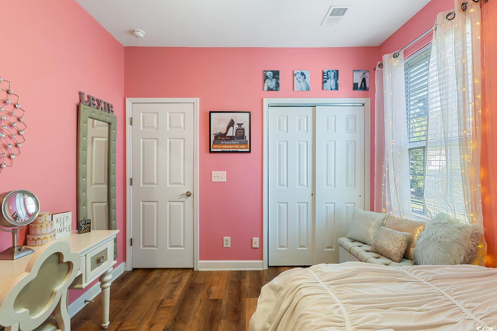 720 Gazania Lane Myrtle Beach, SC 29579 - Photo 20 of 32 Bedroom featuring dark wood-style flooring and a closet