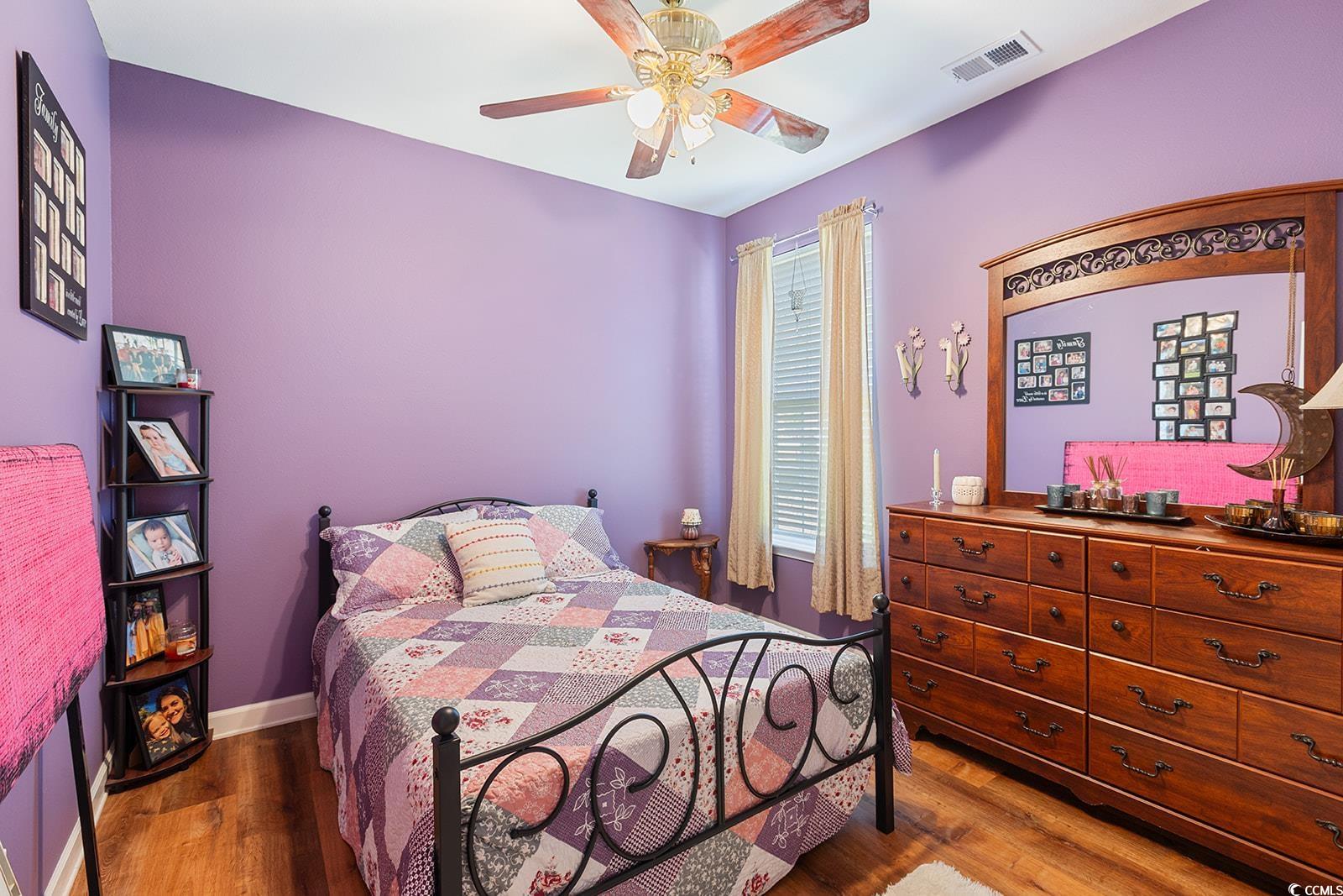 720 Gazania Lane Myrtle Beach, SC 29579 - Photo 21 of 32 Bedroom with dark wood-style flooring and ceiling fan