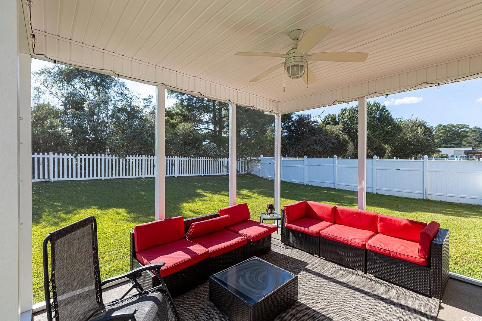 720 Gazania Lane Myrtle Beach, SC 29579 - Photo 24 of 32 Sunroom with a ceiling fan and an outdoor hangout area
