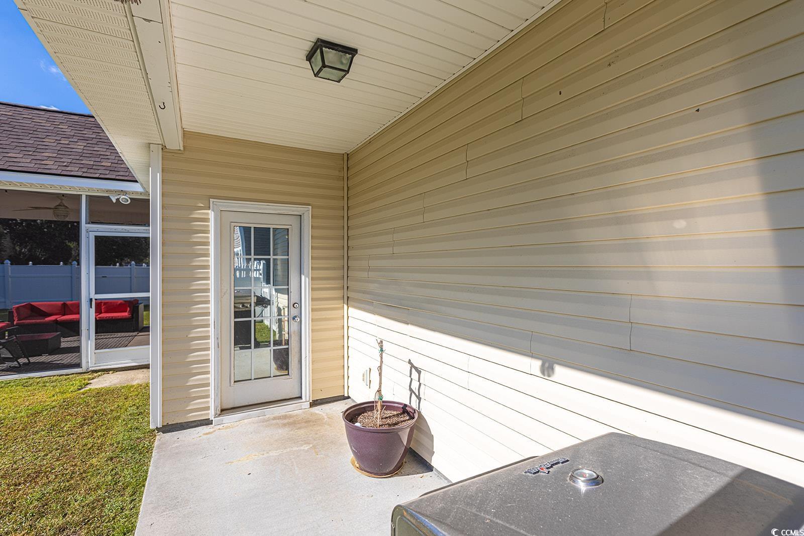 720 Gazania Lane Myrtle Beach, SC 29579 - Photo 25 of 32 Property entrance with a sunroom