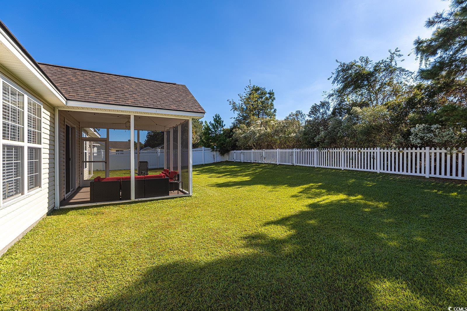 720 Gazania Lane Myrtle Beach, SC 29579 - Photo 5 of 32 Fenced backyard featuring a sunroom