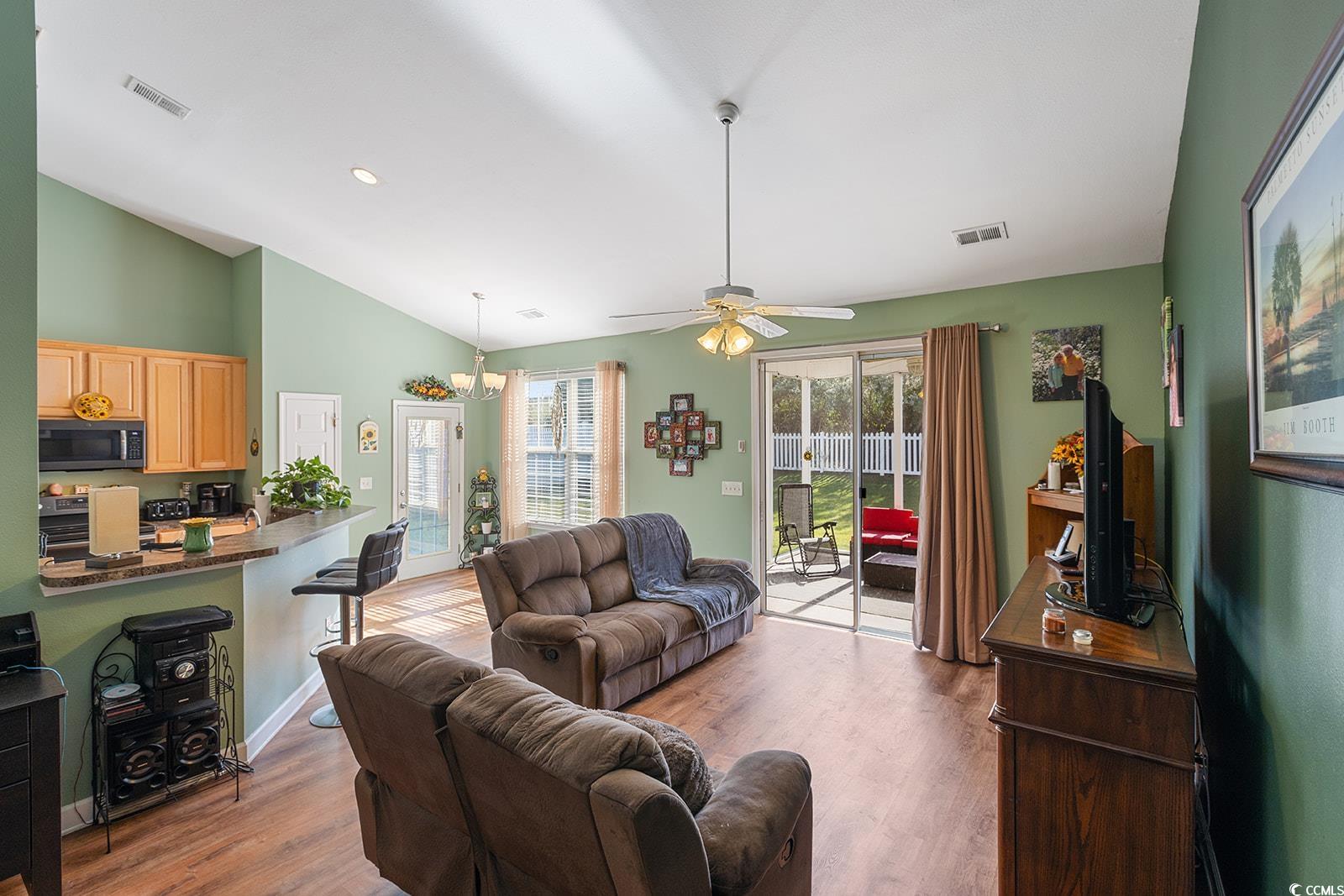 720 Gazania Lane Myrtle Beach, SC 29579 - Photo 7 of 32 Living area featuring wood finished floors, recessed lighting, a ceiling fan, and lofted ceiling