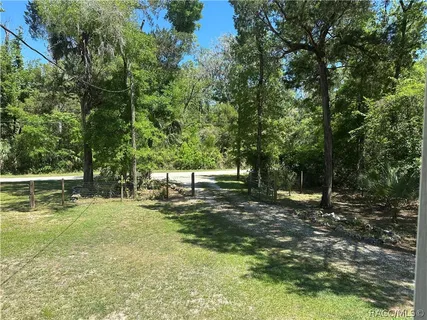 a backyard of a house with lots of green space