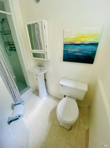 a bathroom with a toilet and a sink