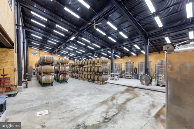 a view of staircase with wooden floor and white walls