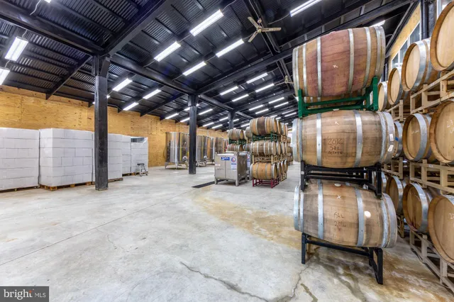 a kitchen with stainless steel appliances a stove and more cabinets