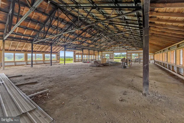 a view of yard with swimming pool and green space