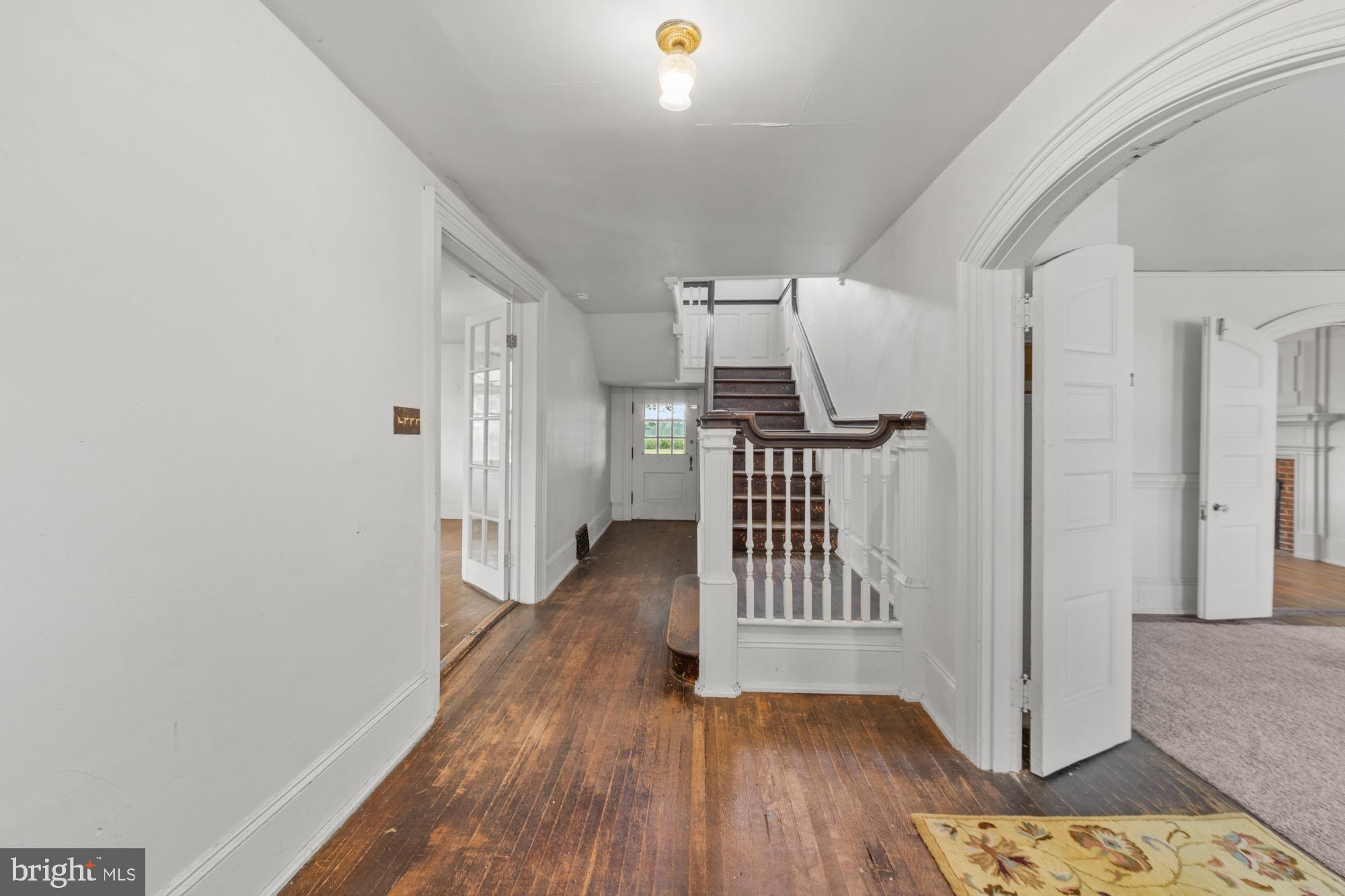 27058 Mt Pleasant Road Columbus, NJ 08022 - Photo 53 of 127 a view of hallway with wooden floor and stairs