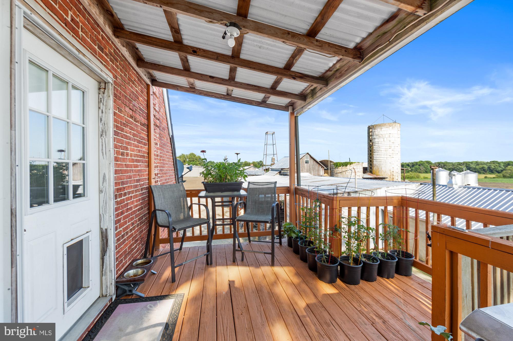 27058 Mt Pleasant Road Columbus, NJ 08022 - Photo 74 of 127 a view of a chairs and table in the balcony