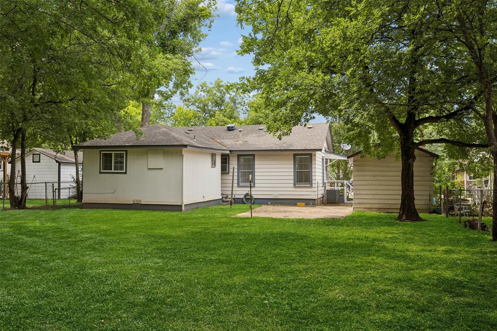 117 Moon Street Cleburne, TX 76033 - Photo 25 of 28 a front view of a house with a garden