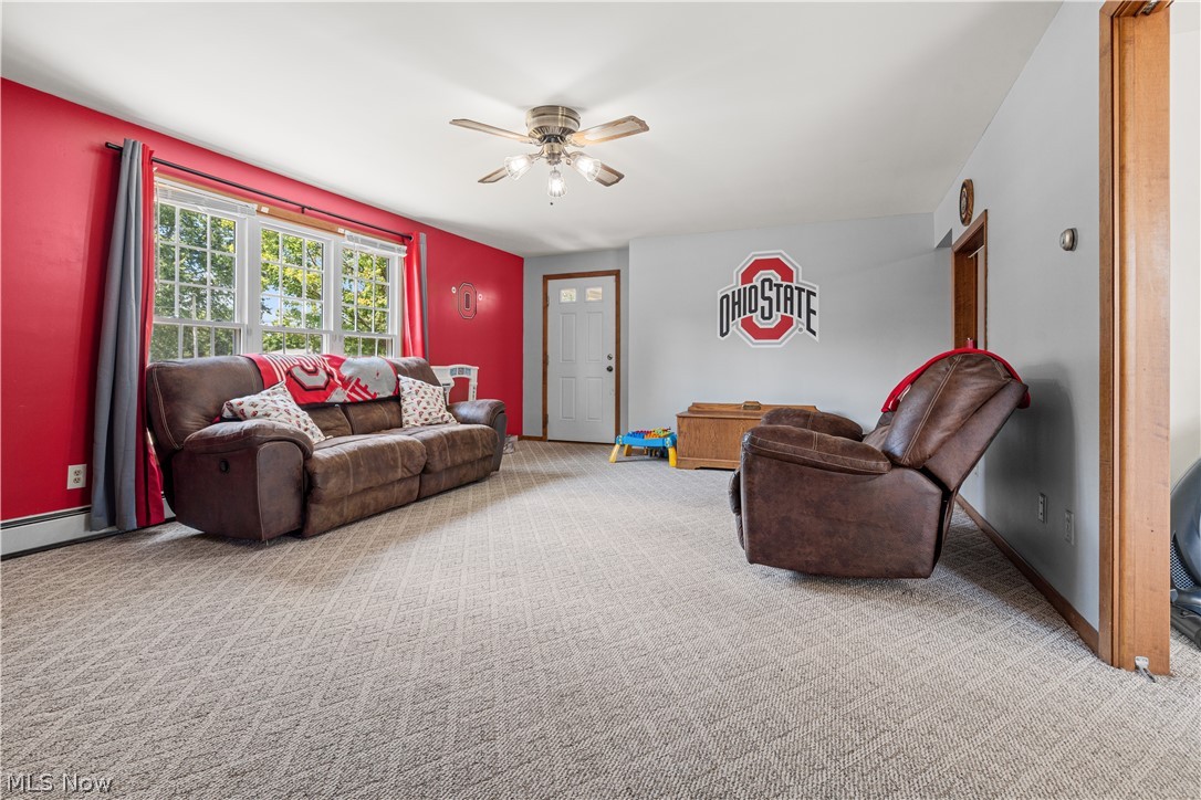 3650 Rambo Avenue Alliance, OH 44601 - Photo 24 of 36 Textured carpeting, white ceiling, white trim, ceiling fan light fixture, and a white interior door