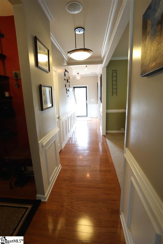 24 Blue Slate Court Greenville, SC 29607 - Photo 7 of 33 The hall has upgraded trim to include chair rail, judges panels and crown molding.