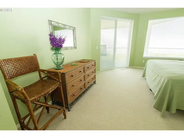 a bed room with furniture and a window