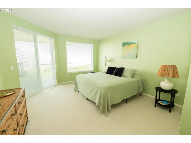 a bedroom with a bed and a chair