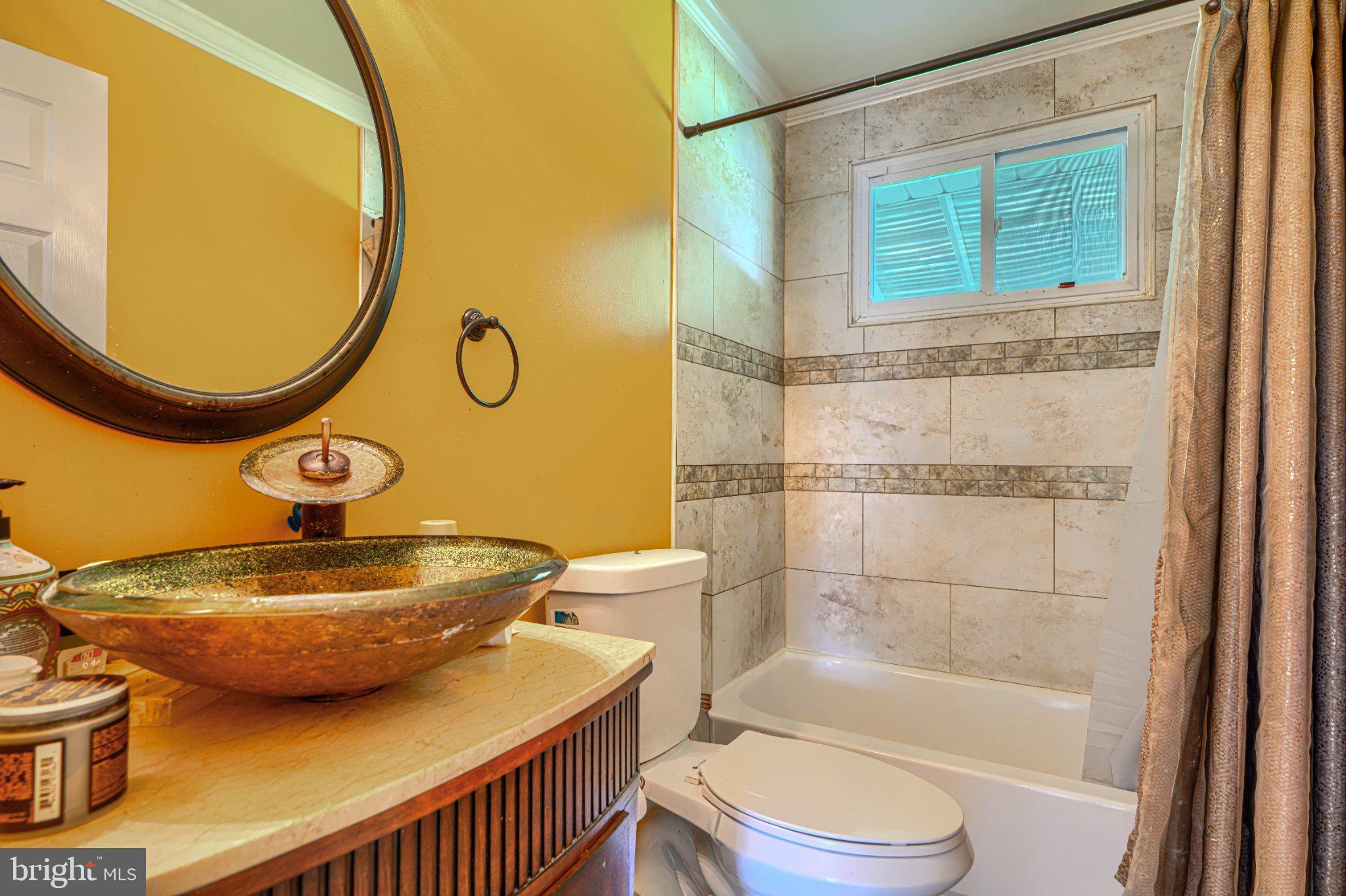 3708 Cassen Road Randallstown, MD 21133 - Photo 20 of 38 a bathroom with a sink a toilet and a bathtub
