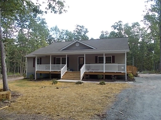 412 Jacoby Road Louisa, VA 23093 - Photo 1 of 7 a front view of a house with a yard and outdoor seating