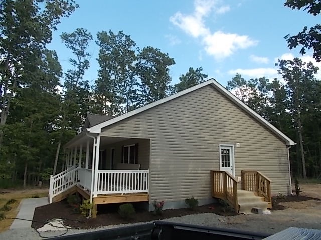 412 Jacoby Road Louisa, VA 23093 - Photo 2 of 7 a view of a house with a yard