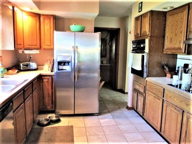 954 Winborne Road Lake Summerset, IL 61019 - Photo 11 of 26 a kitchen with stainless steel appliances granite countertop a refrigerator a stove and a sink