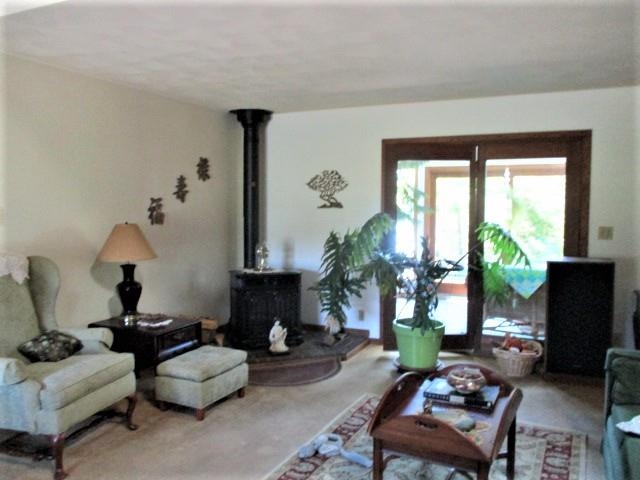 954 Winborne Road Lake Summerset, IL 61019 - Photo 13 of 26 a living room with furniture and a large window