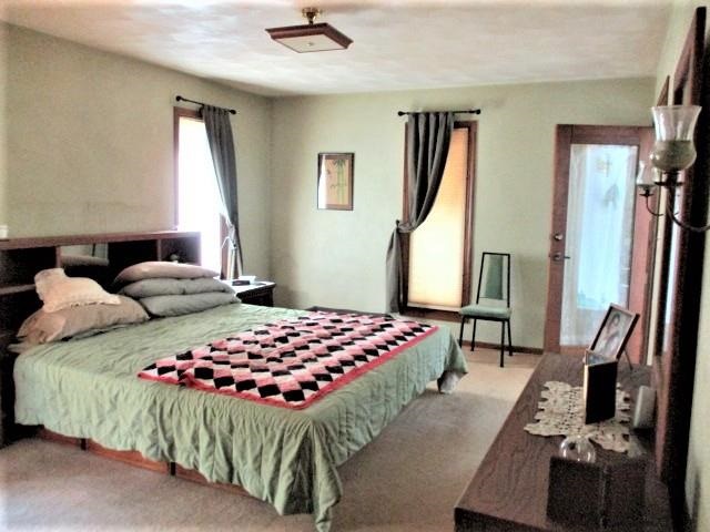 954 Winborne Road Lake Summerset, IL 61019 - Photo 15 of 26 a bedroom with a bed and a dresser