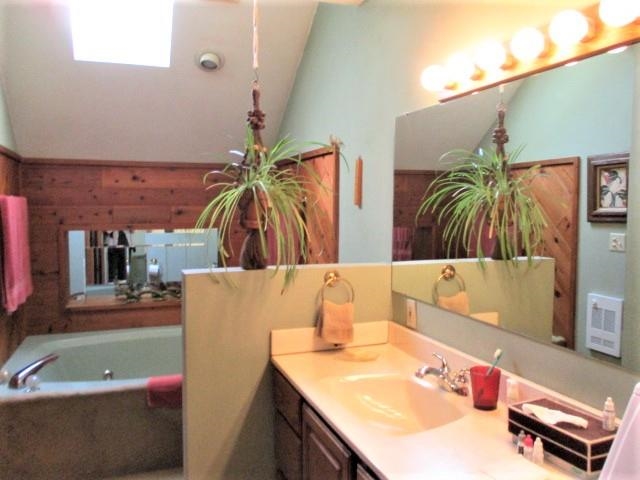 954 Winborne Road Lake Summerset, IL 61019 - Photo 18 of 26 a bathroom with a tub sink and mirror