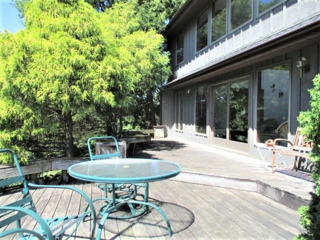 954 Winborne Road Lake Summerset, IL 61019 - Photo 9 of 26 a view of a patio with table and chairs and potted plants