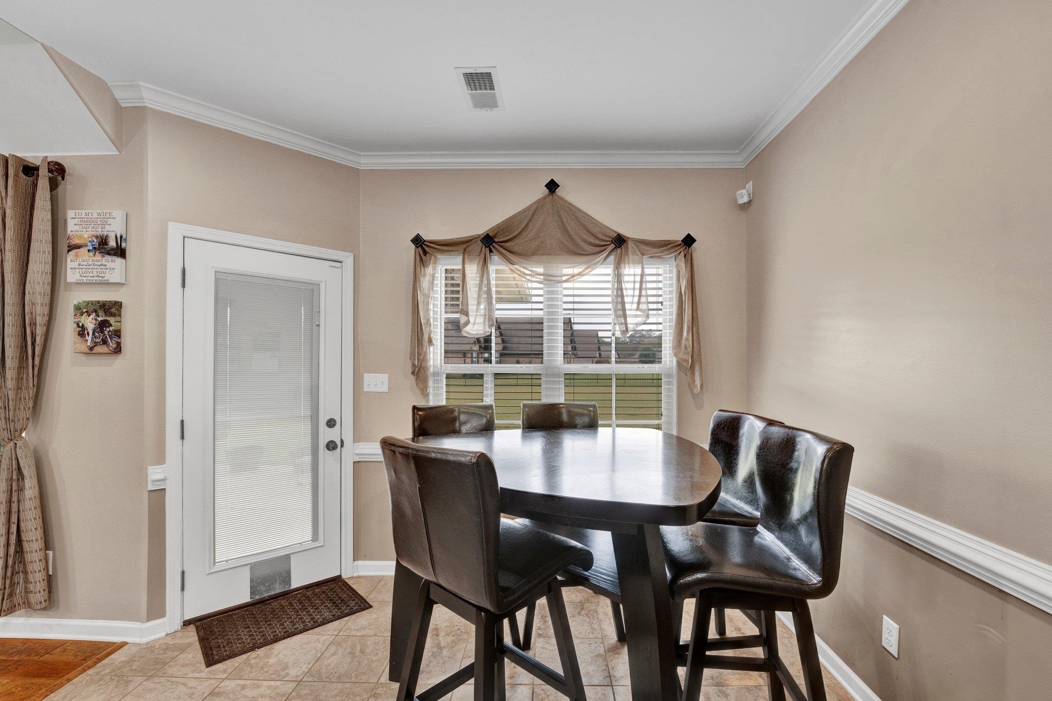 250 Pearl Road Somerville, TN 38068 - Photo 4 of 13 Tiled dining room with crown molding