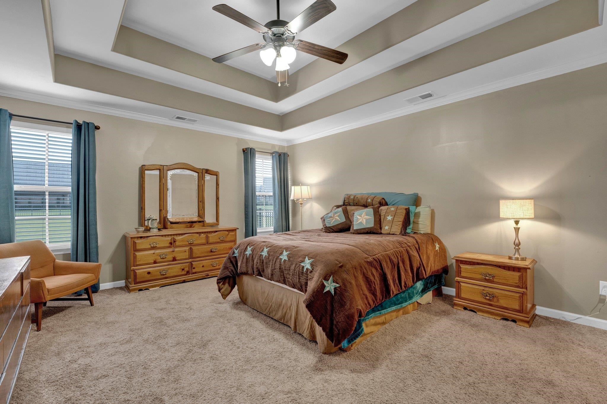 250 Pearl Road Somerville, TN 38068 - Photo 8 of 13 Bedroom with a tray ceiling, light carpet, ceiling fan, and ornamental molding