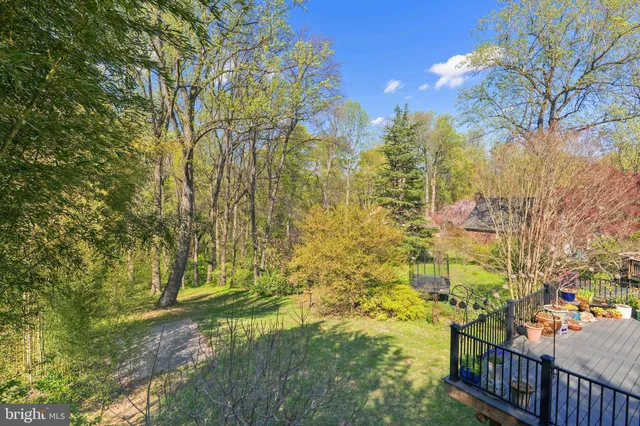 a view of house with yard