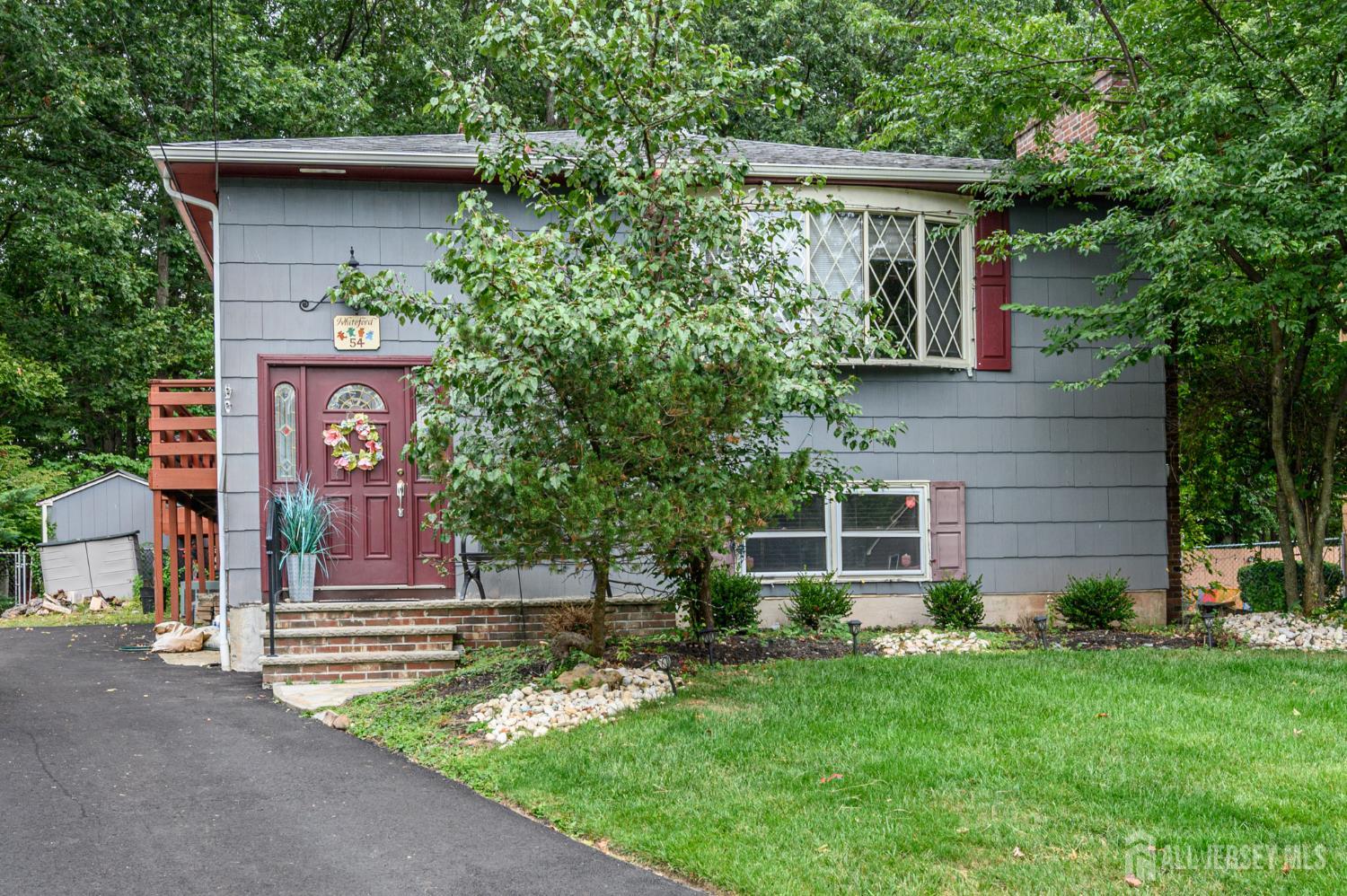 a front view of a house with garden