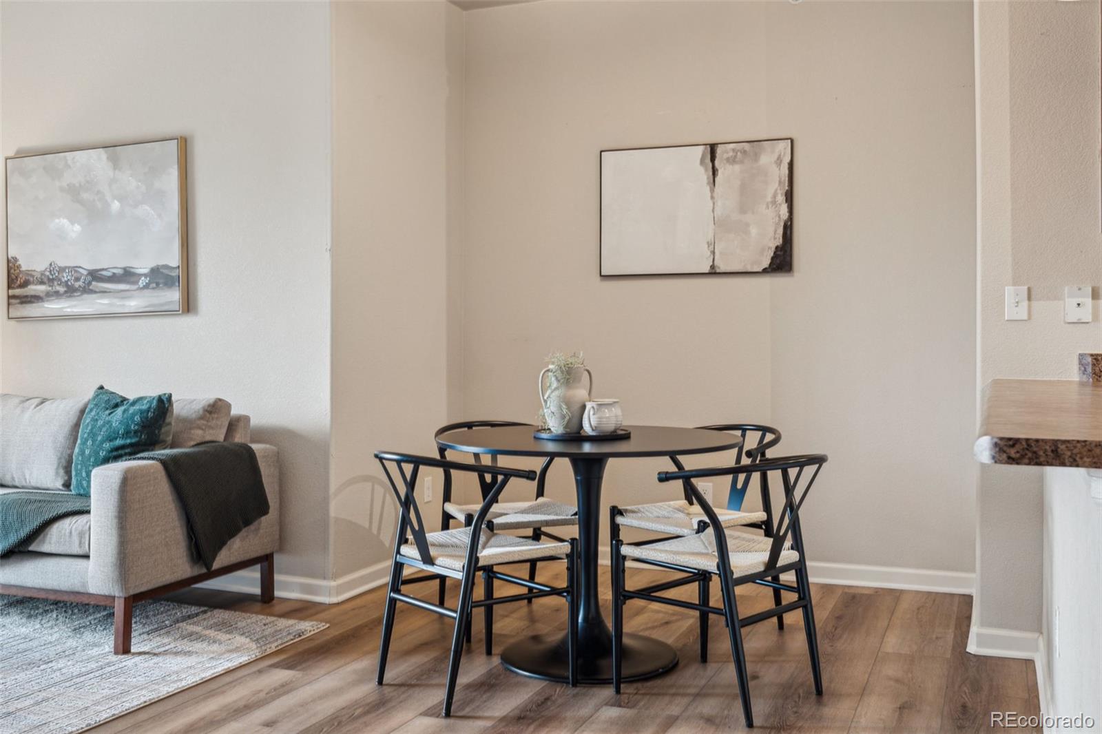 1062 Rockhurst Drive, Unit 401 Highlands Ranch, CO 80129 - Photo 15 of 41 a view of a dining room with furniture and wooden floor