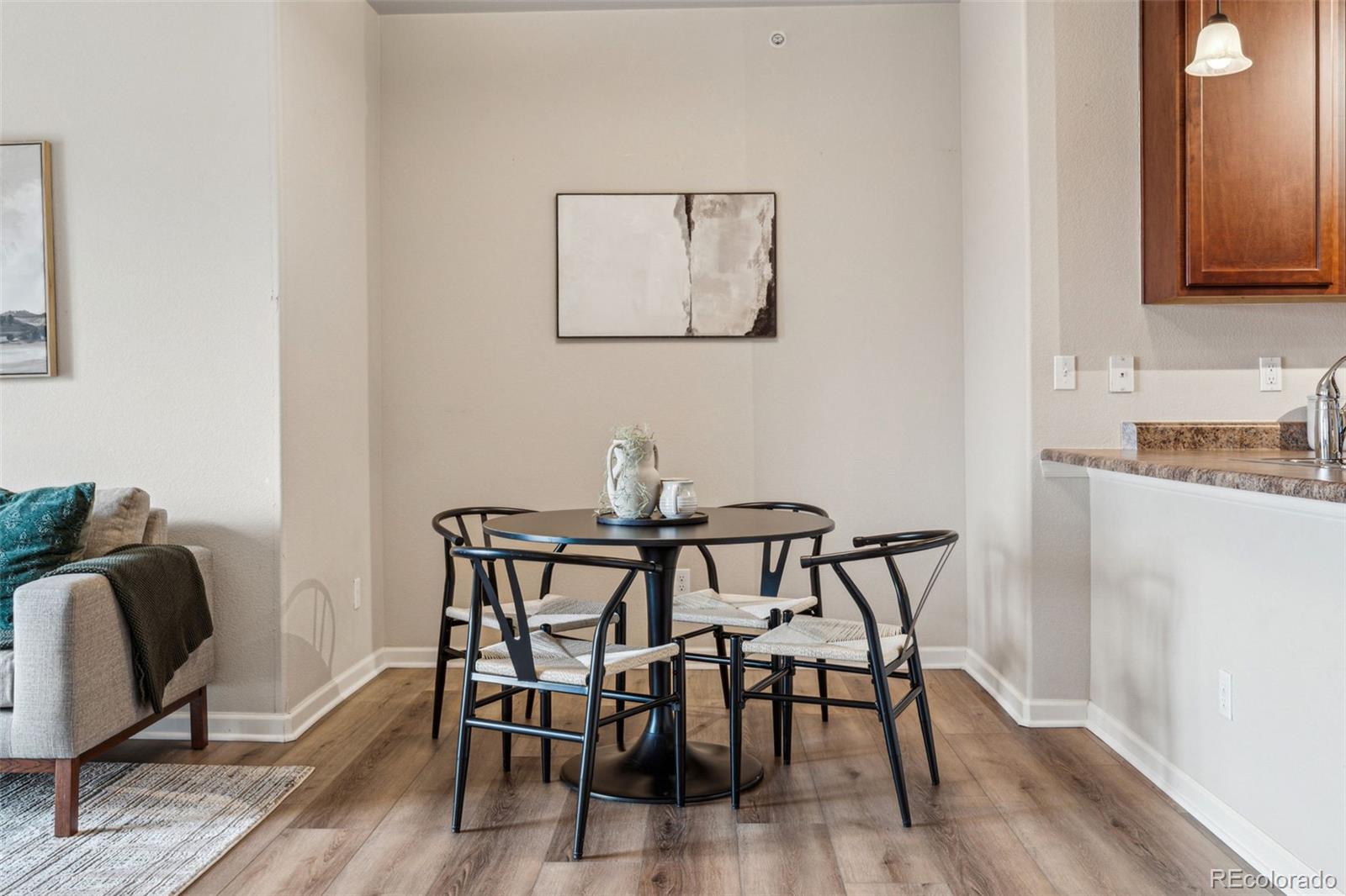 1062 Rockhurst Drive, Unit 401 Highlands Ranch, CO 80129 - Photo 16 of 41 a view of a dining room with furniture and wooden floor