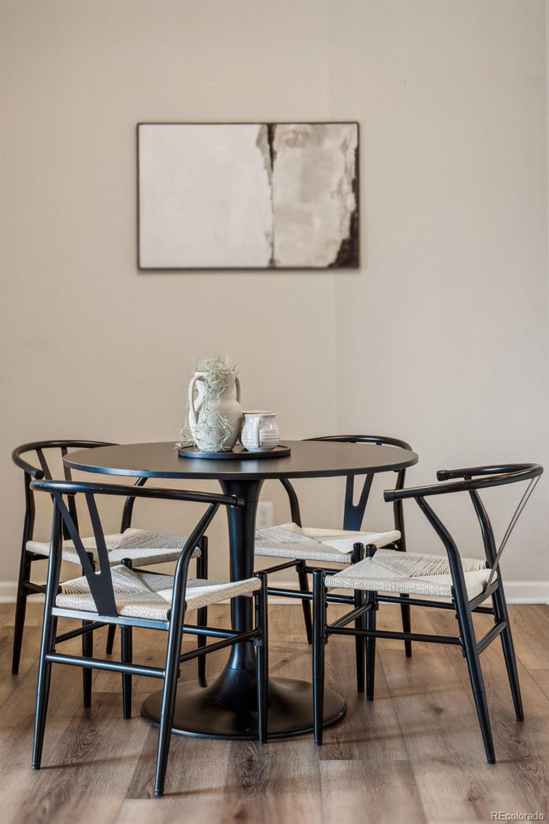 1062 Rockhurst Drive, Unit 401 Highlands Ranch, CO 80129 - Photo 17 of 41 a view of a dining room with furniture and wooden floor