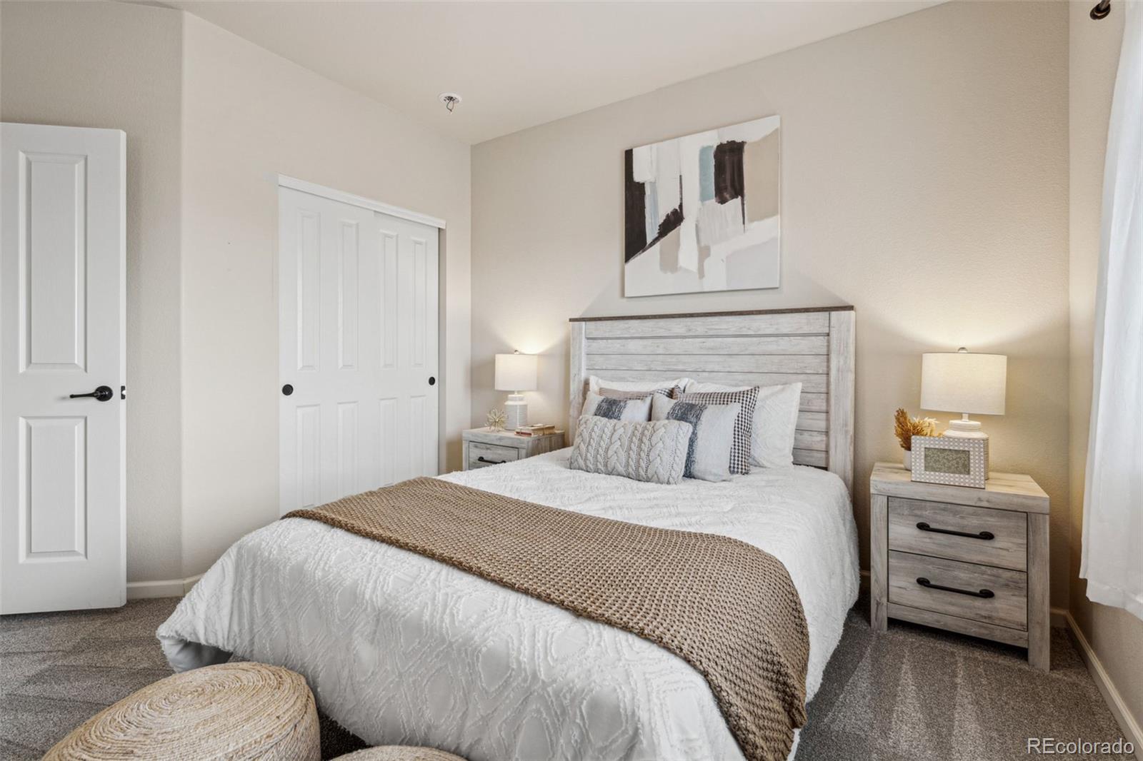 1062 Rockhurst Drive, Unit 401 Highlands Ranch, CO 80129 - Photo 25 of 41 a bedroom with a bed and a dresser