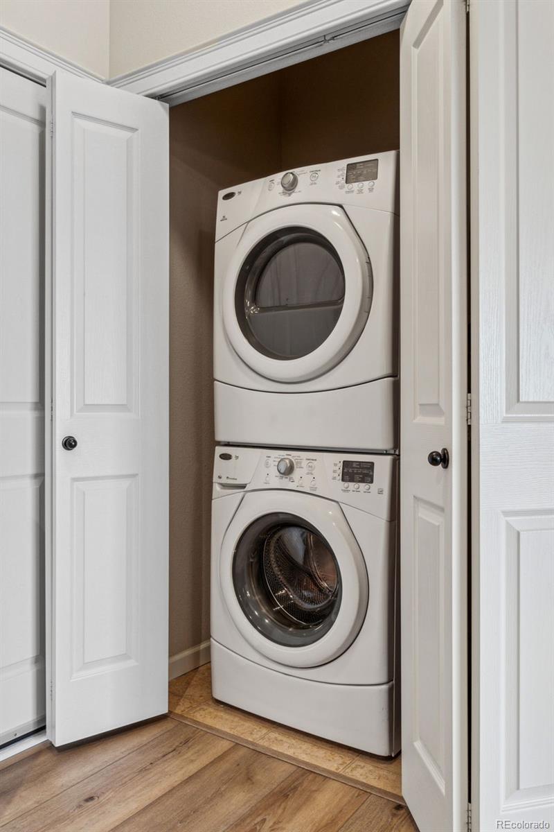 1062 Rockhurst Drive, Unit 401 Highlands Ranch, CO 80129 - Photo 34 of 41 a utility room with dryer and washer