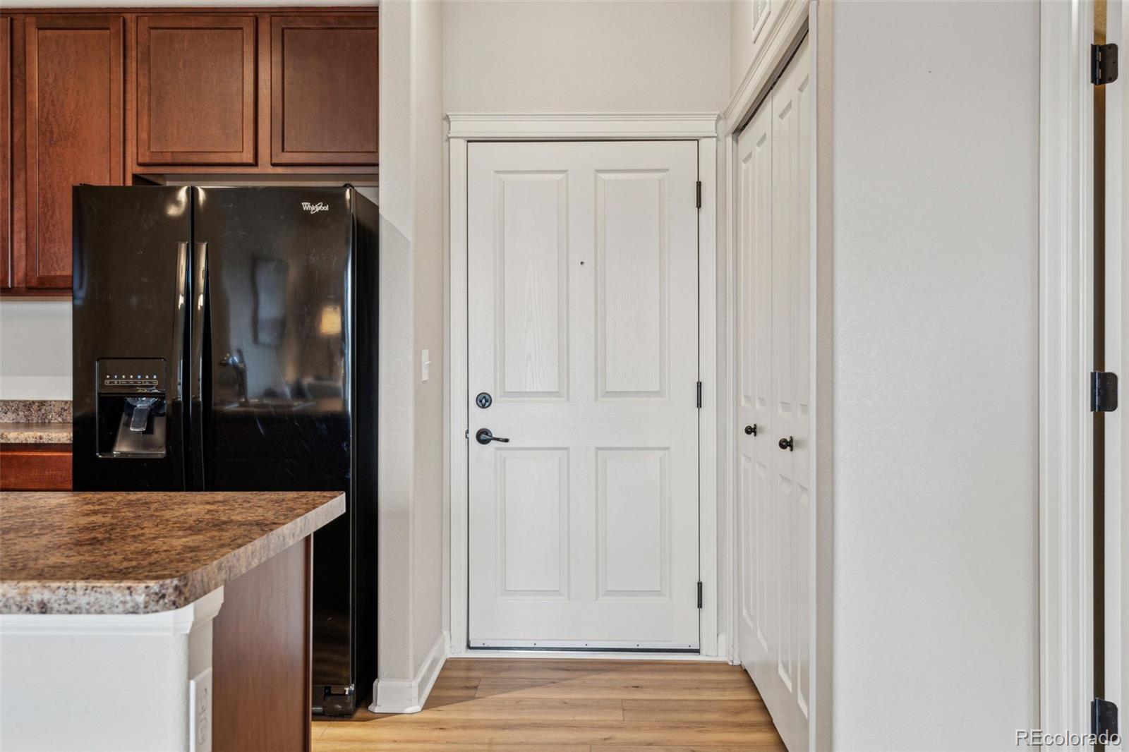 1062 Rockhurst Drive, Unit 401 Highlands Ranch, CO 80129 - Photo 35 of 41 a view of a kitchen with granite countertop cabinets