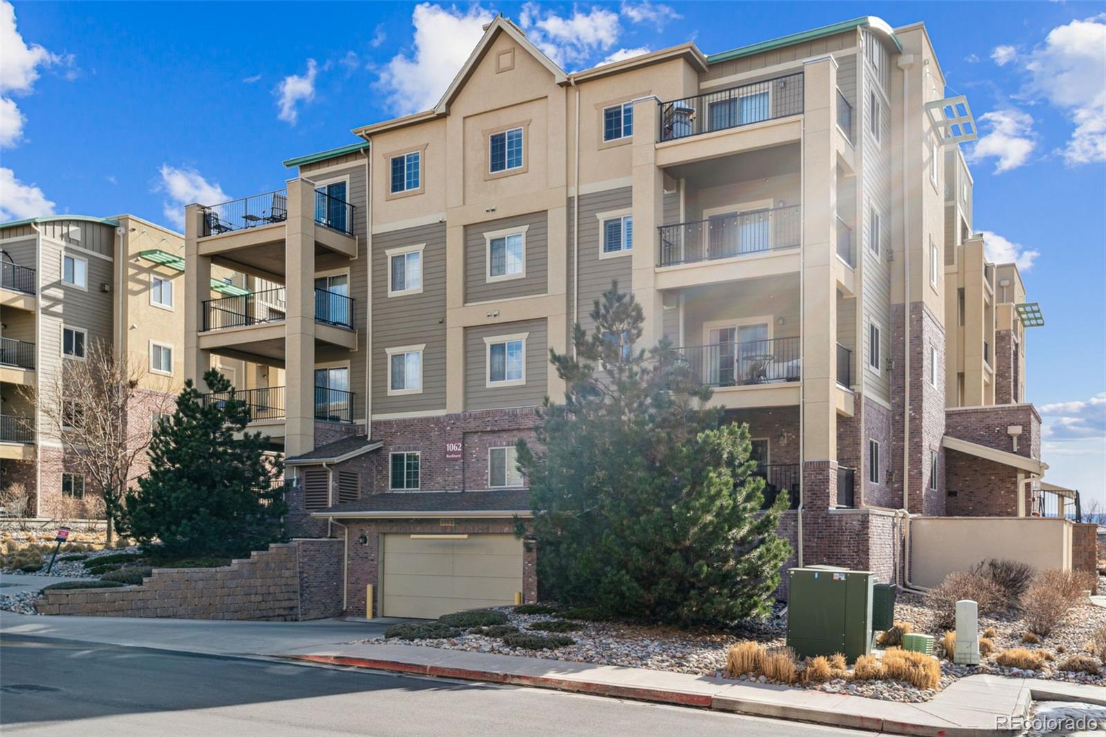 1062 Rockhurst Drive, Unit 401 Highlands Ranch, CO 80129 - Photo 36 of 41 a view of a building with a yard