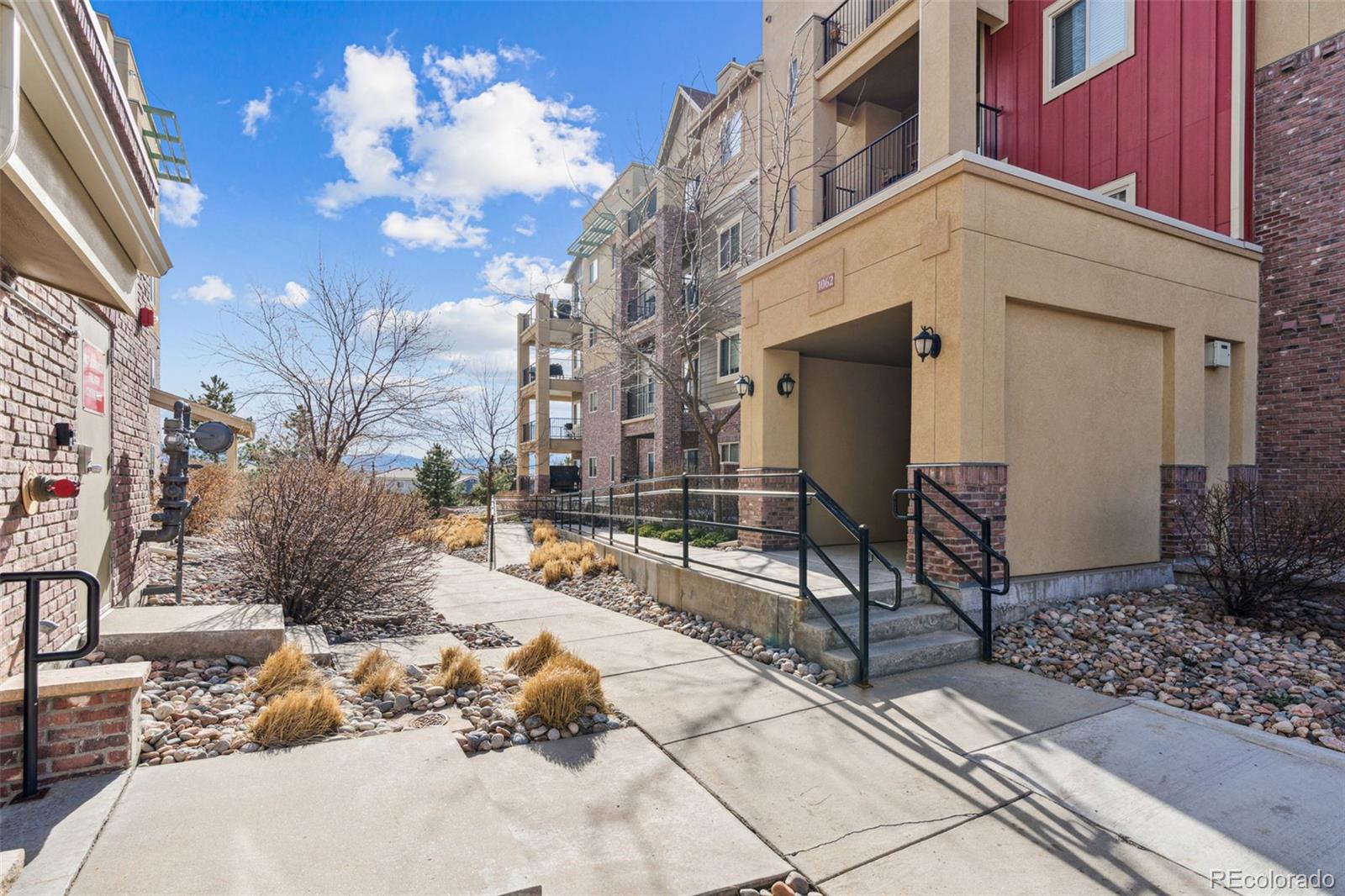 1062 Rockhurst Drive, Unit 401 Highlands Ranch, CO 80129 - Photo 38 of 41 a view of a backyard with sitting area