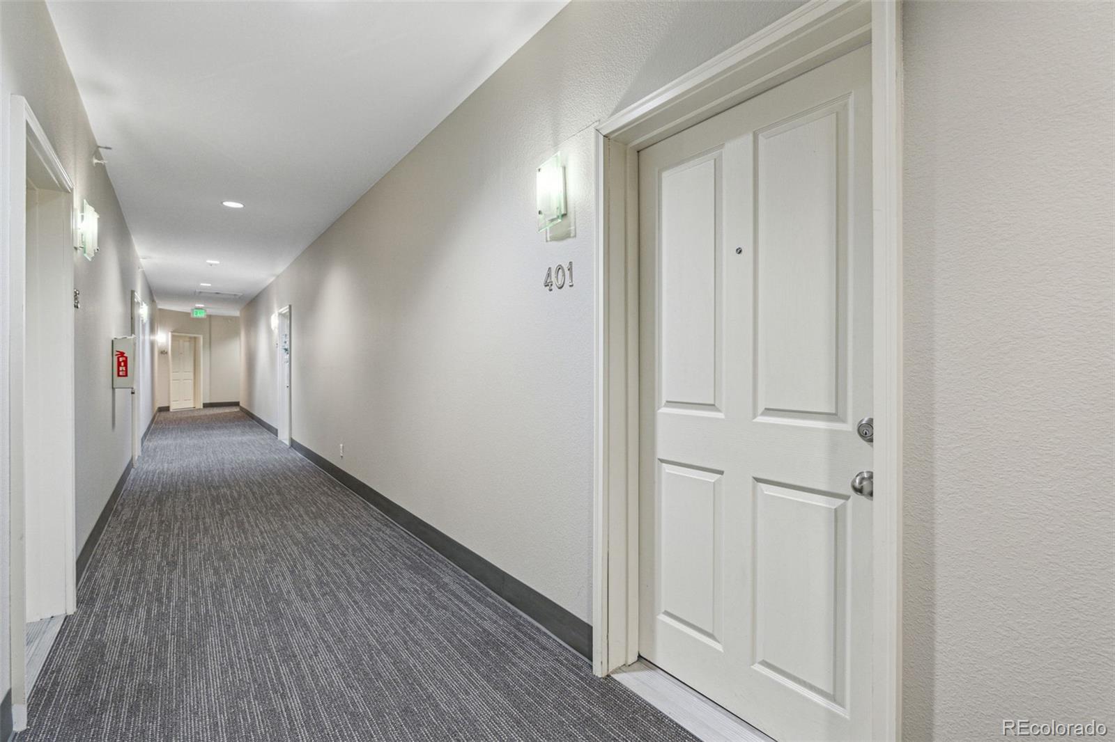 1062 Rockhurst Drive, Unit 401 Highlands Ranch, CO 80129 - Photo 39 of 41 a view of hallway with wooden floor